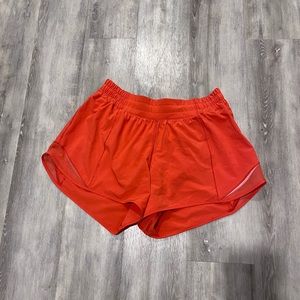 Like new condition. 5” inseam and mid-rise. Bright orange, ltd ed colour.